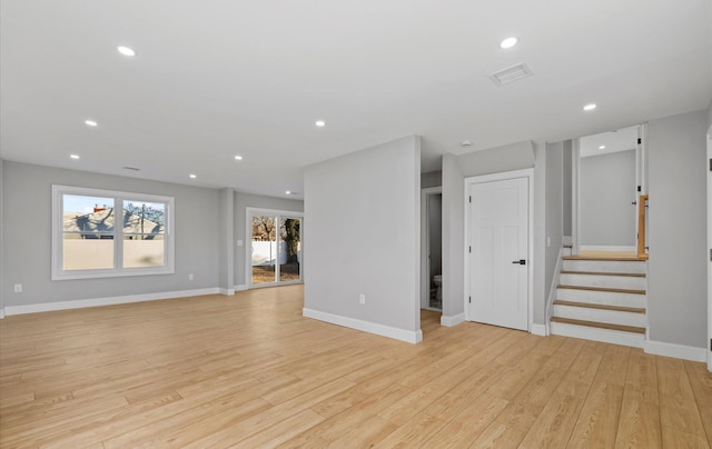 unfurnished living room with light hardwood / wood-style flooring