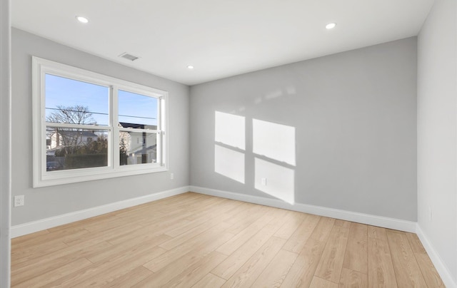 spare room with light hardwood / wood-style floors