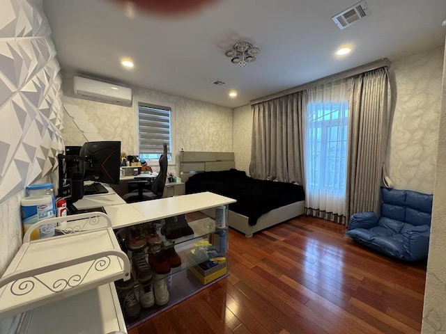 interior space with an AC wall unit and dark hardwood / wood-style floors