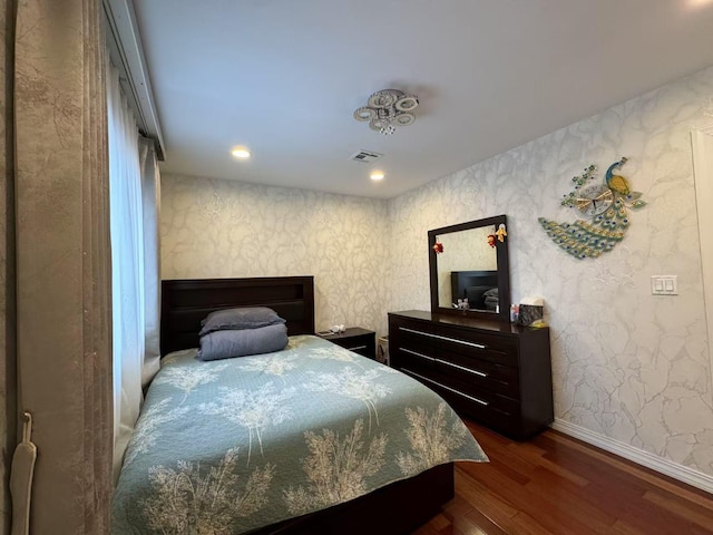 bedroom featuring dark wood-type flooring