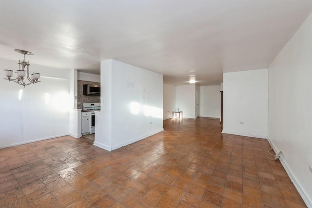 empty room featuring a notable chandelier