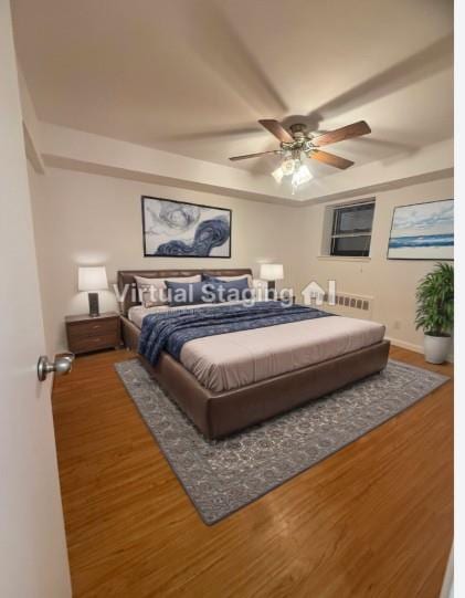 bedroom featuring dark wood-type flooring and ceiling fan