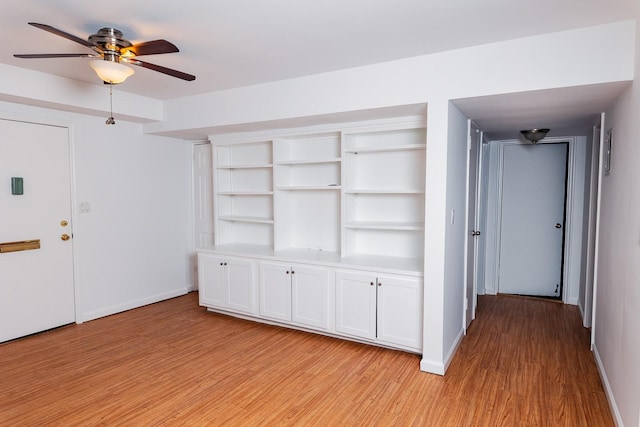 interior space with ceiling fan and light wood-type flooring