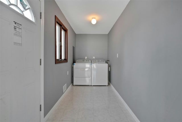 laundry room with separate washer and dryer