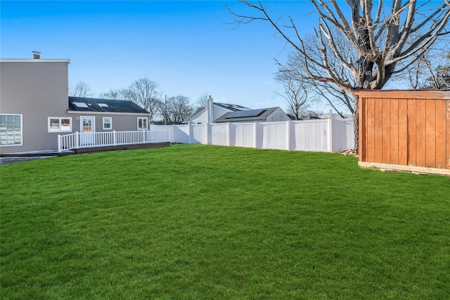 view of yard featuring a wooden deck