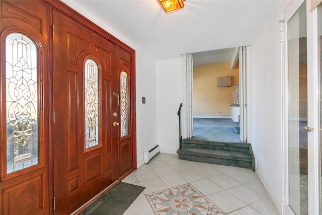 foyer entrance featuring baseboard heating and light tile patterned floors