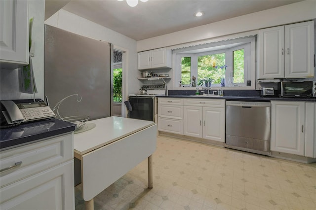 kitchen featuring dishwasher, white cabinetry, white range with electric cooktop, and sink