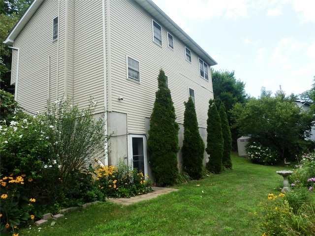 view of property exterior featuring a yard