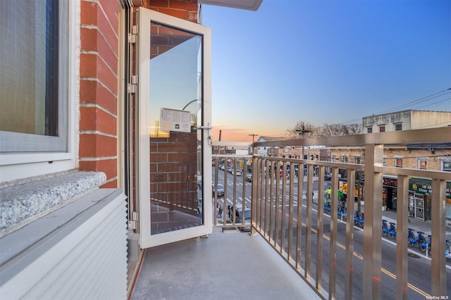 view of balcony at dusk