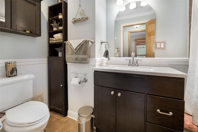 bathroom featuring toilet, vanity, tile patterned floors, and crown molding