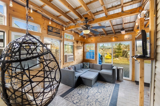 sunroom with ceiling fan, cooling unit, and beam ceiling