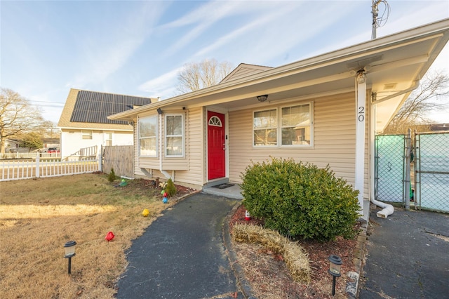 single story home with covered porch