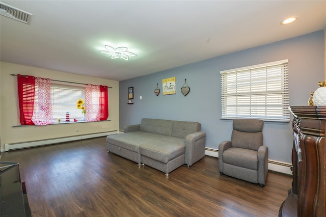 living room featuring a baseboard radiator and dark wood-type flooring