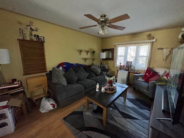 living room with hardwood / wood-style floors and ceiling fan