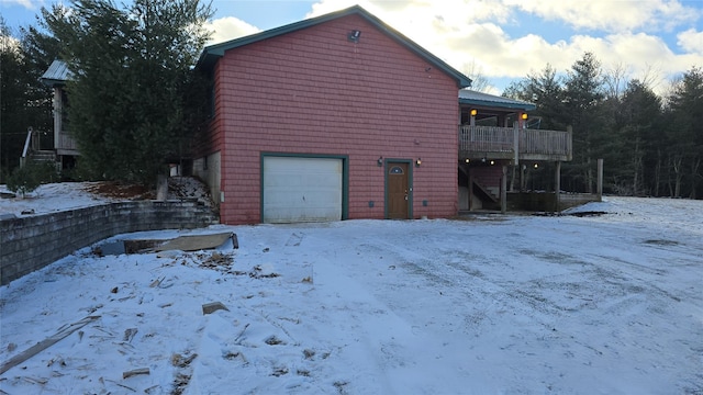 exterior space with a balcony and a garage