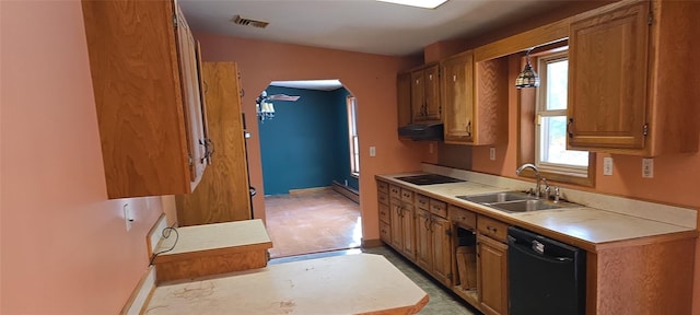 kitchen with black appliances, sink, and exhaust hood