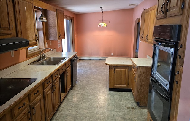 kitchen with baseboard heating, sink, black appliances, and decorative light fixtures