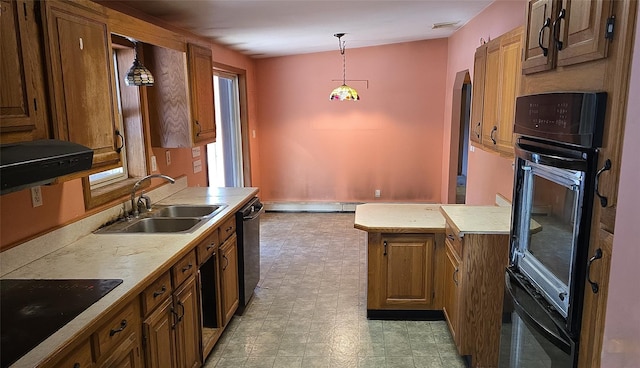 kitchen with baseboard heating, hanging light fixtures, black appliances, and sink