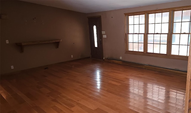 interior space featuring light hardwood / wood-style floors and a baseboard heating unit