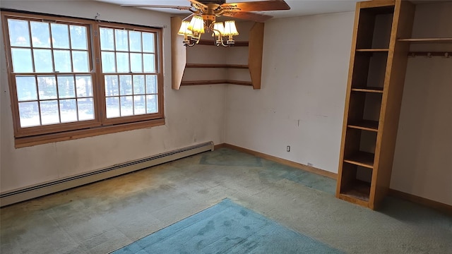 interior space with baseboard heating, ceiling fan, and carpet flooring