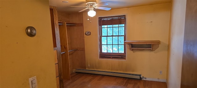 interior space featuring ceiling fan, light hardwood / wood-style floors, and a baseboard radiator