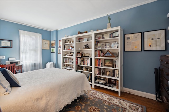 bedroom featuring dark wood finished floors and baseboards