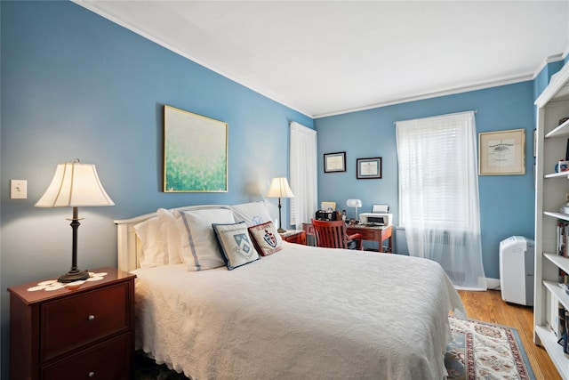 bedroom featuring light wood-style flooring