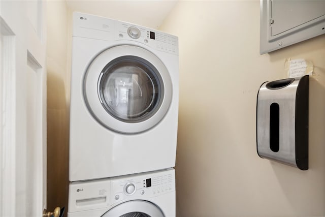 laundry room with laundry area and stacked washer / drying machine