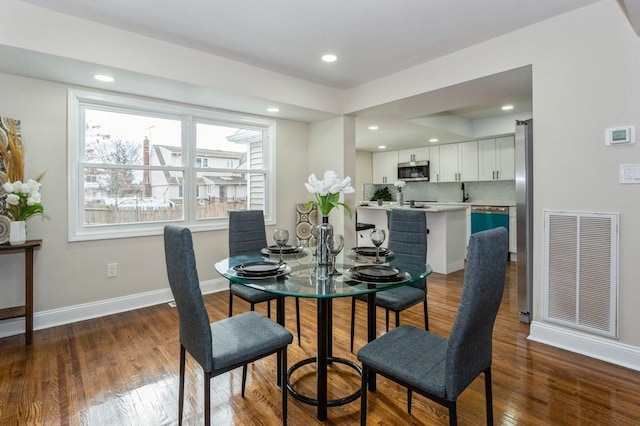 dining room featuring dark wood-type flooring