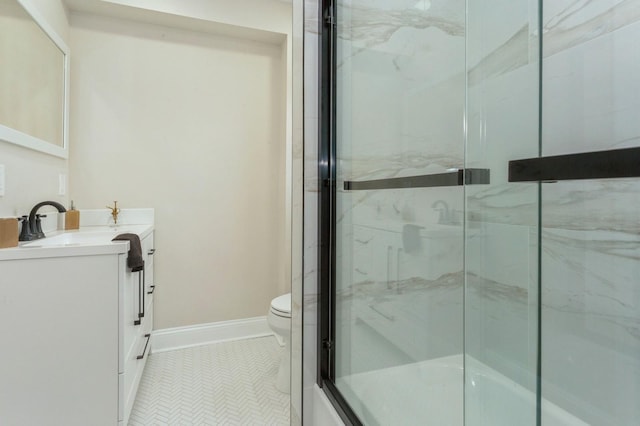 bathroom featuring toilet, vanity, and tile patterned floors