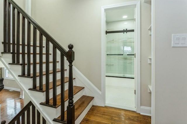 stairs with wood-type flooring