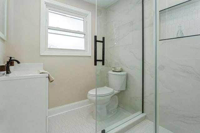 bathroom featuring toilet, tile patterned floors, a shower with door, and vanity