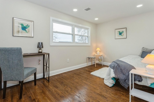 bedroom with dark wood-type flooring