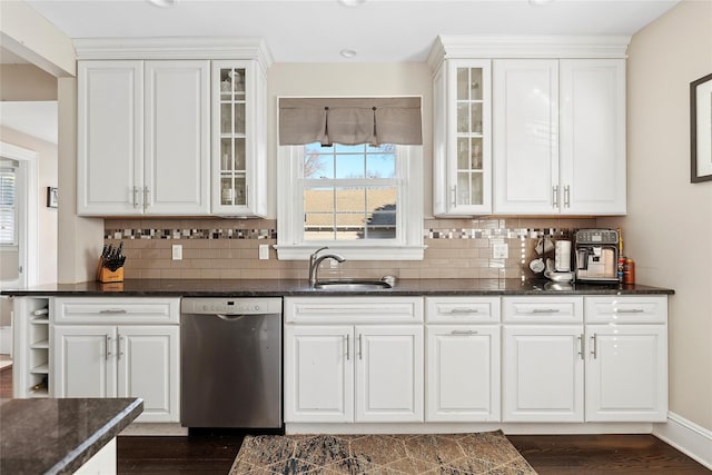 kitchen with dishwasher, white cabinetry, and sink