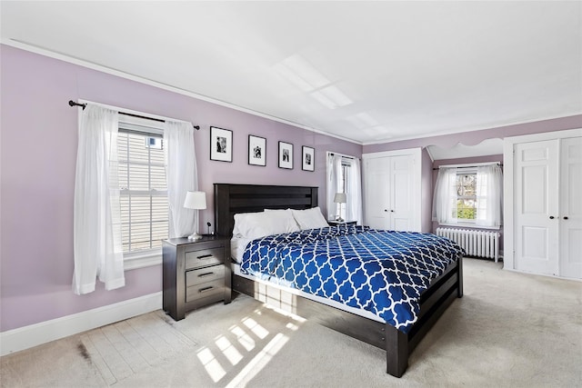 bedroom with light carpet, multiple windows, radiator, and ornamental molding