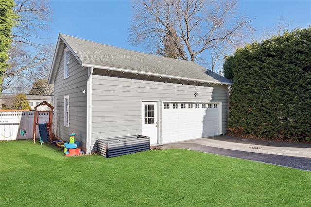 garage featuring a lawn