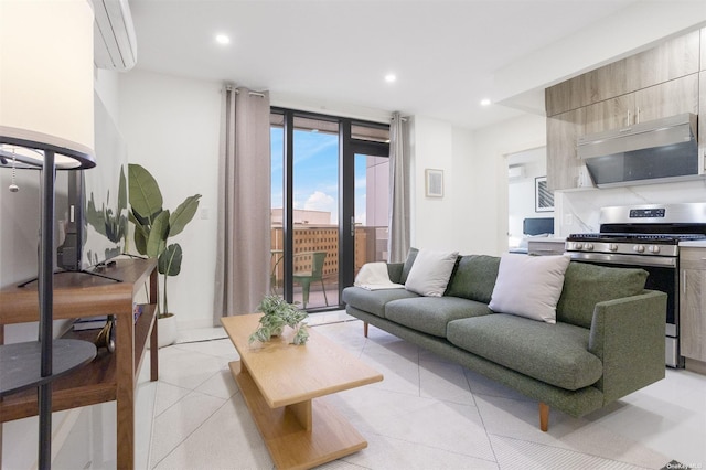 living room with a wall of windows and light tile patterned floors