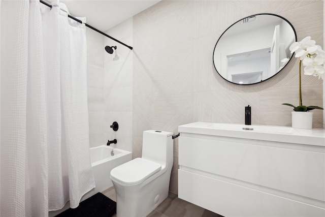 full bathroom featuring sink, shower / bath combo, tile walls, and toilet