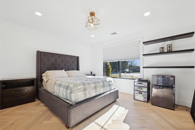 bedroom with light parquet floors