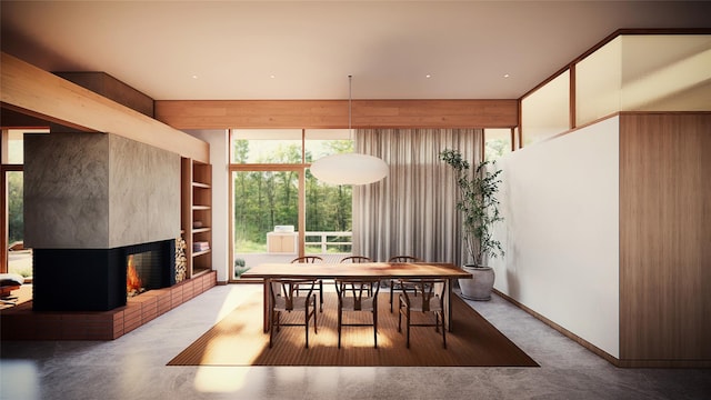 dining room with built in shelves and a brick fireplace