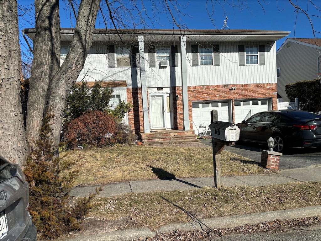 view of front of property with a garage