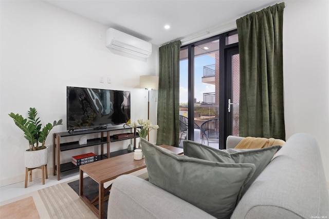 living room with a wall of windows, a wall mounted AC, and light tile patterned flooring