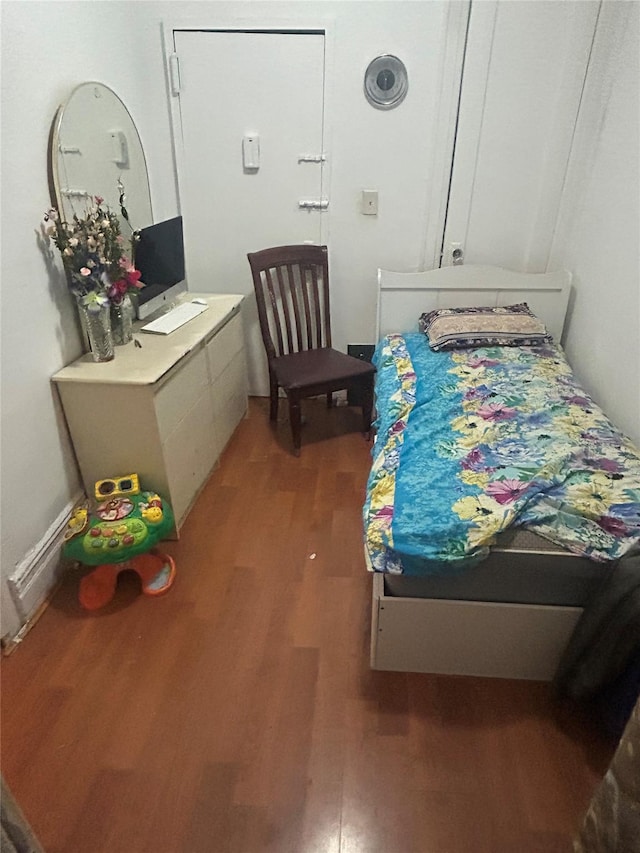 bedroom featuring hardwood / wood-style floors