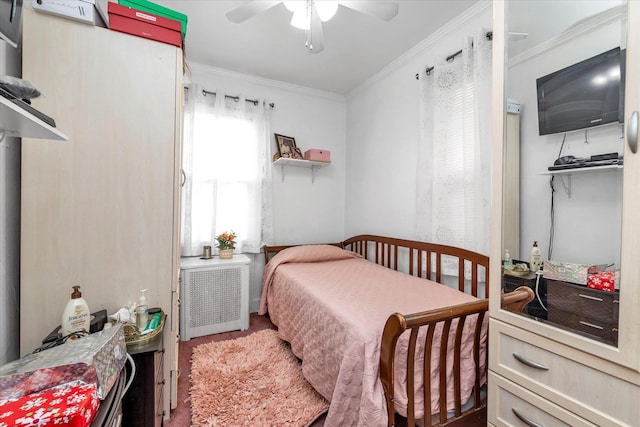 bedroom with radiator heating unit, ceiling fan, and ornamental molding