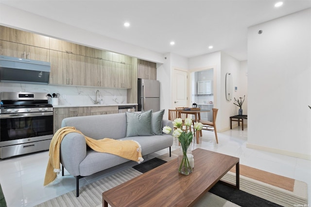 living room with sink and light tile patterned floors