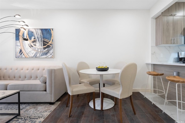 dining area with hardwood / wood-style floors