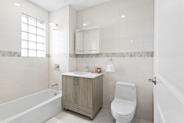 full bathroom with vanity, shower / washtub combination, toilet, and tile walls