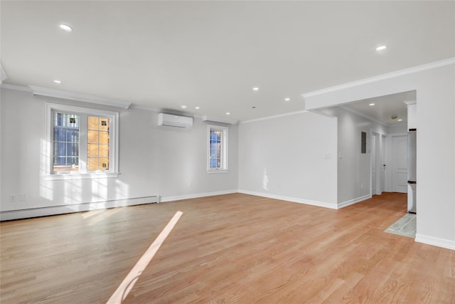 spare room featuring a wall unit AC, crown molding, and a baseboard radiator