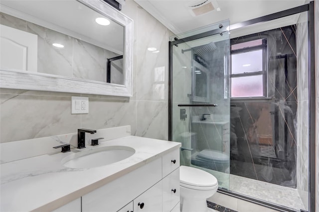 bathroom with vanity, crown molding, toilet, tile walls, and an enclosed shower