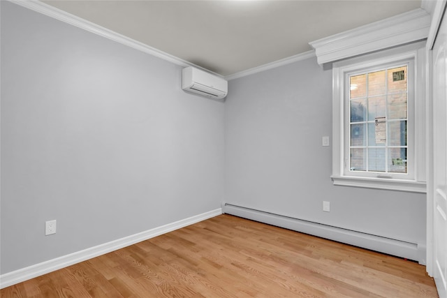 spare room featuring a wall mounted air conditioner, light wood-type flooring, crown molding, and a baseboard heating unit